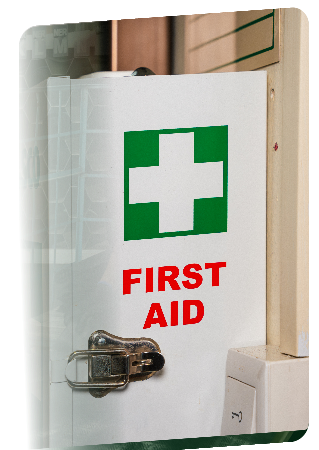 Wall-mounted Alsco first aid cabinet with a green cross, part of a managed first aid service