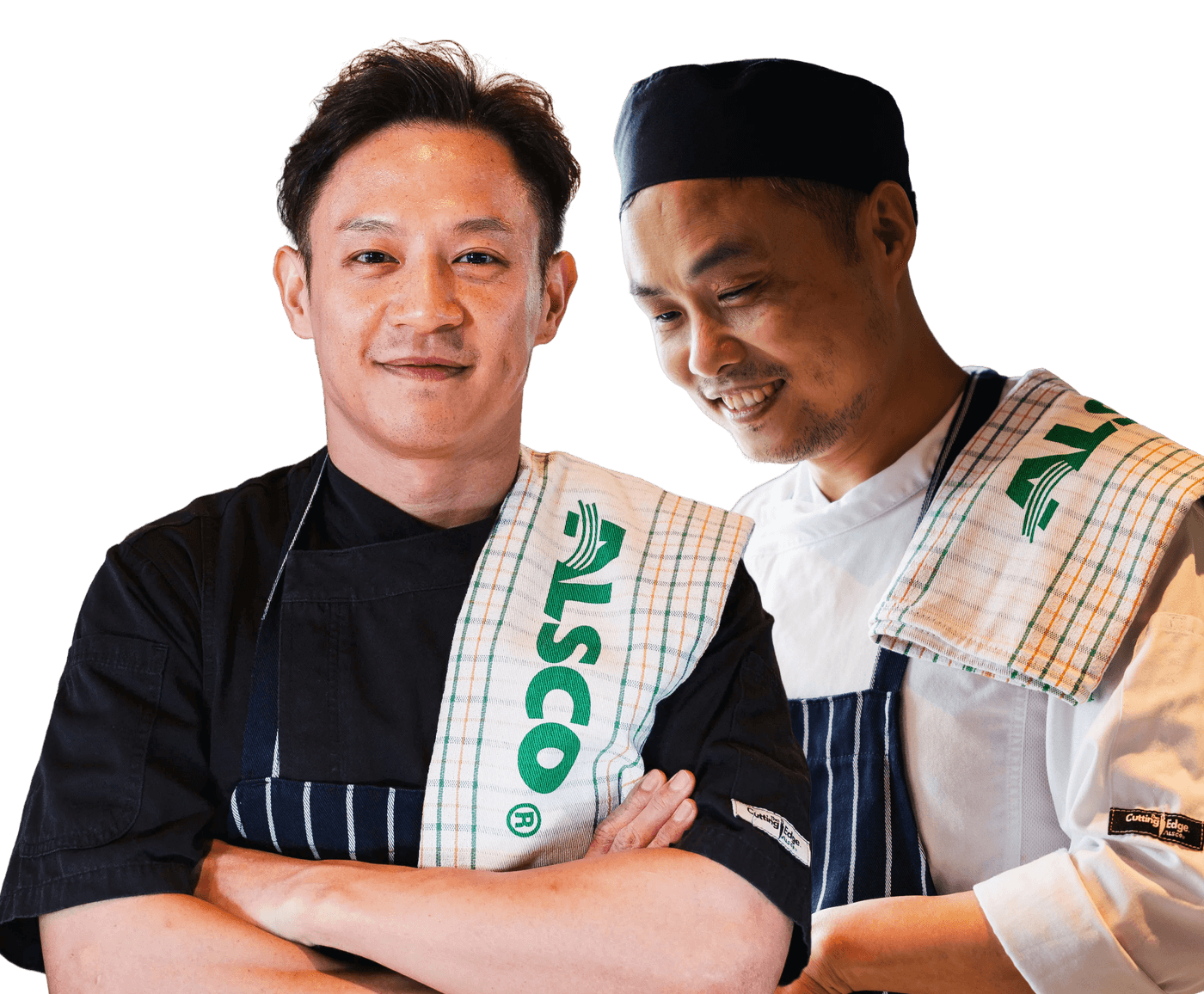Two chefs in black and white Cutting Edge chef jackets and striped aprons, each with an Alsco tea towel over a shoulder