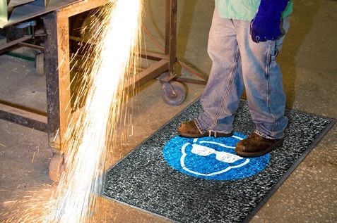 Person standing on Alsco Safety Mat