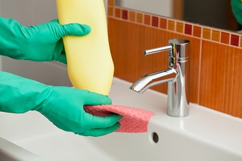 Person cleaning the sink