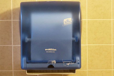 Washroom tissue dispenser