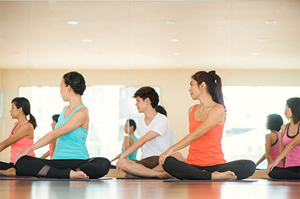 Employees taking yoga class