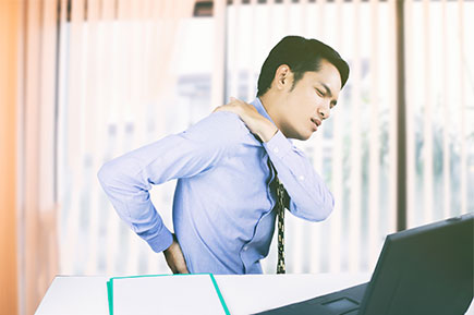 Asian businessmen with back pain in an office