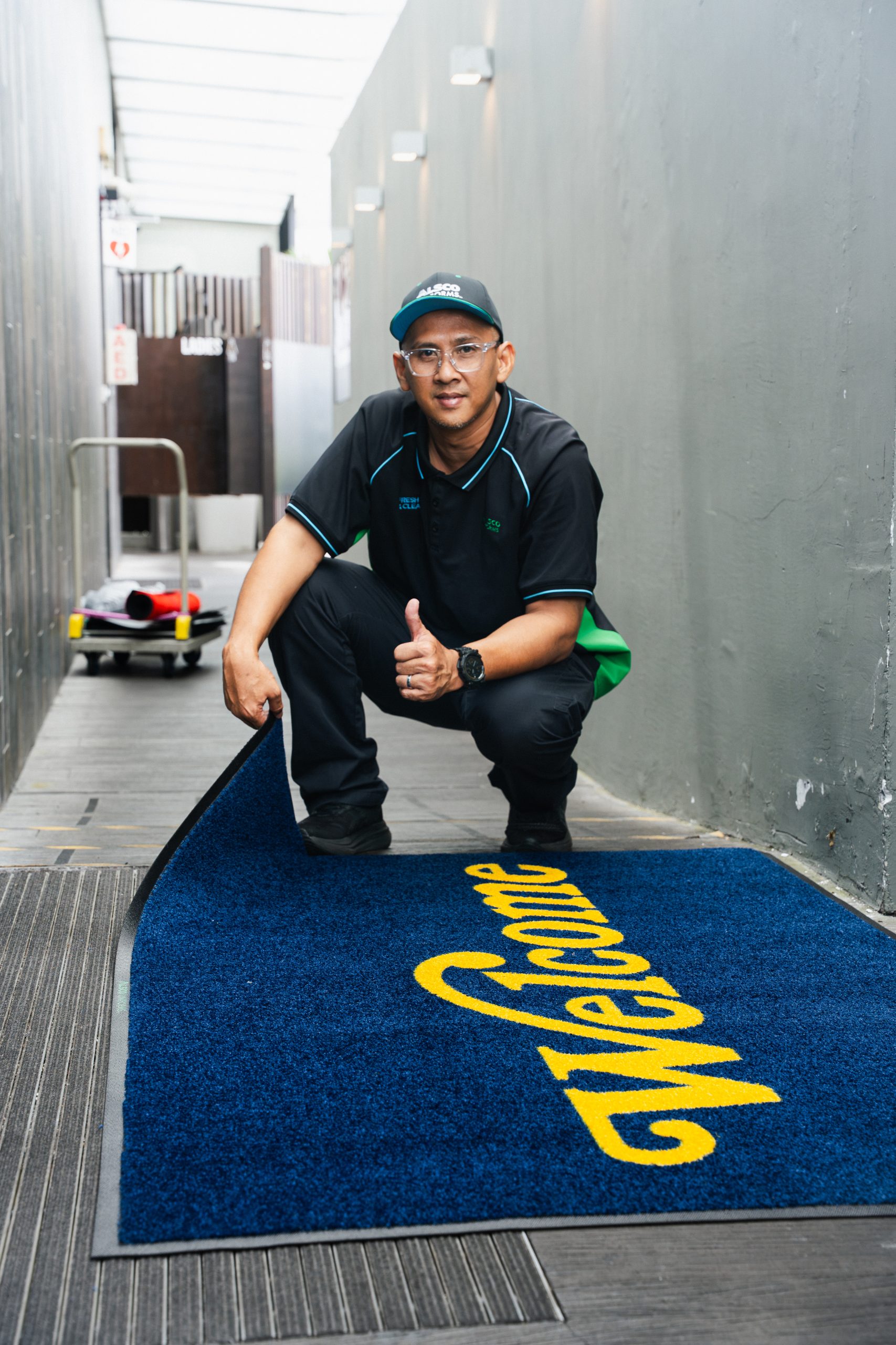 Ginkyō team member standing on an Alsco commercial kitchen mat