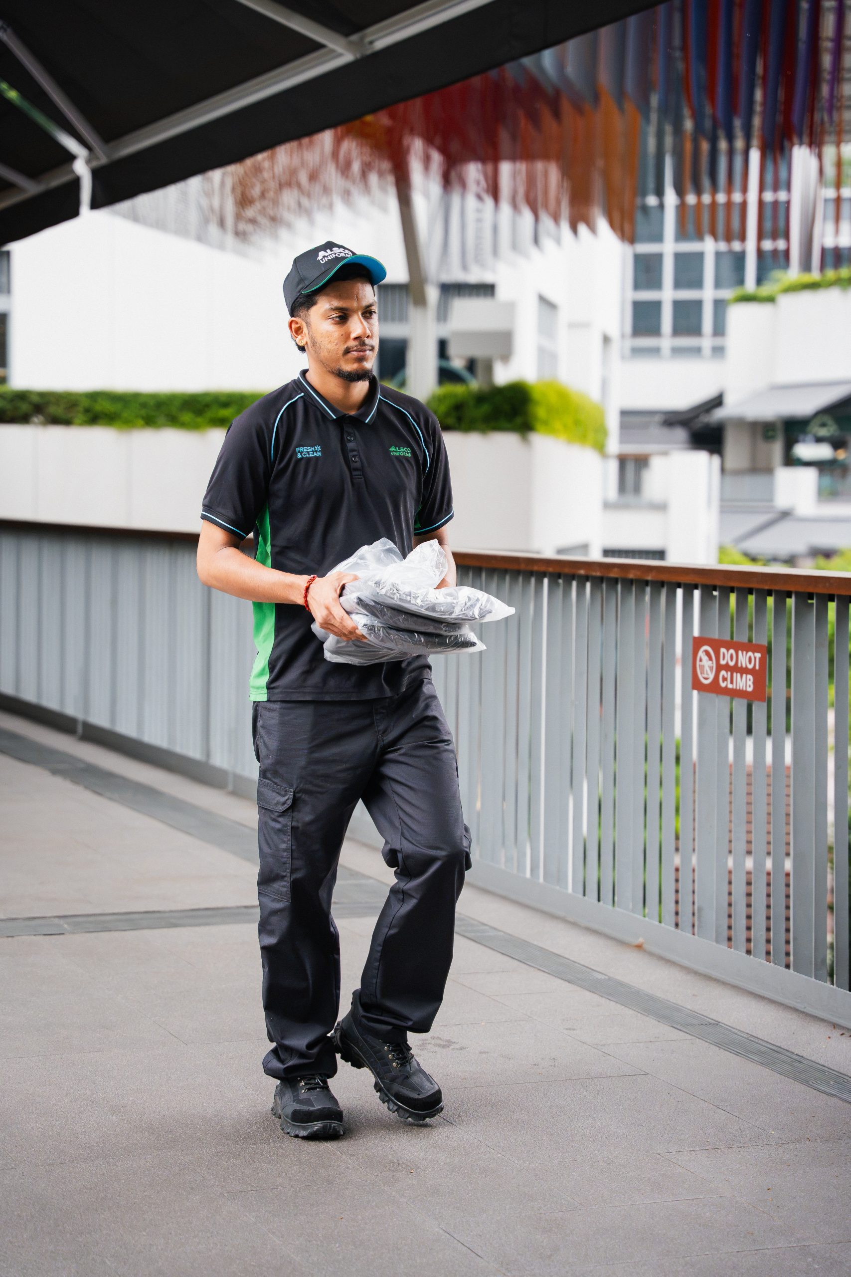 Alsco Singapore uniform laundering process with industrial washing machines at full capacity