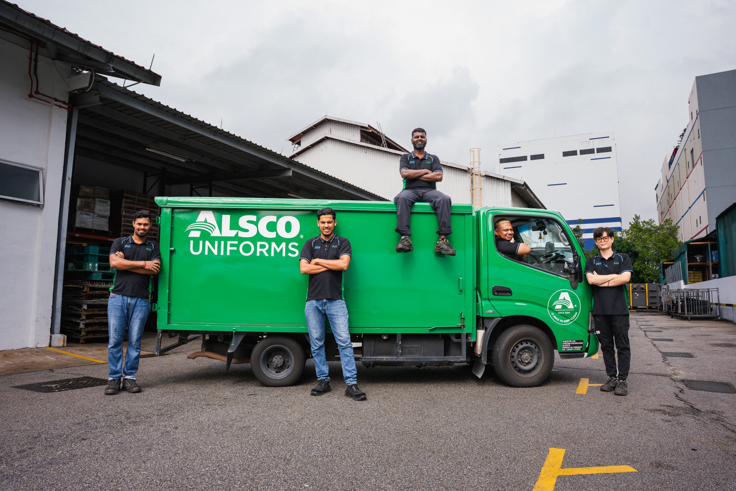 Alsco Singapore uniform processing line with garments moving through industrial dryers