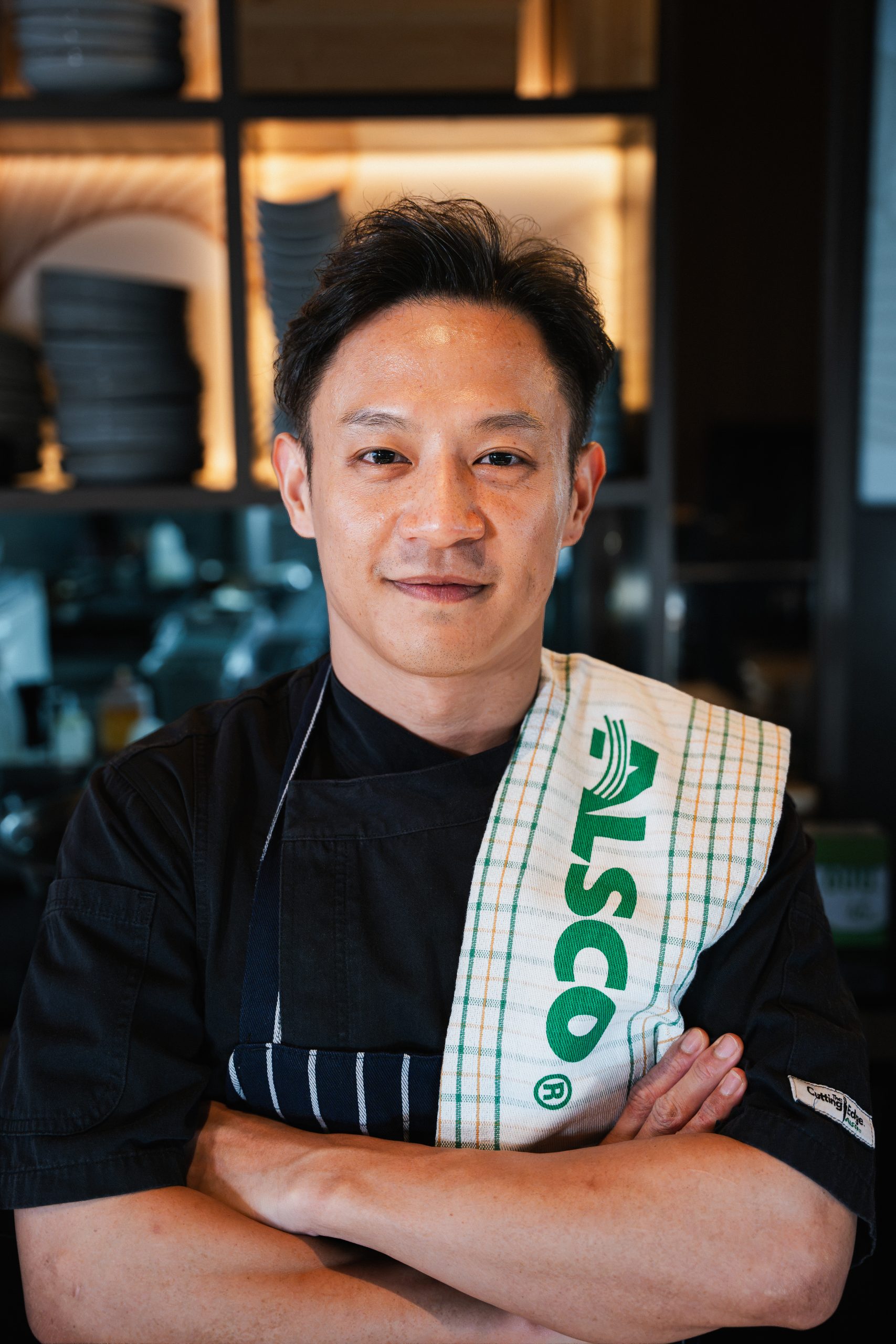 Chef wearing Alsco premium chefswear and holding a linen towel